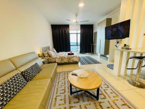 a living room with a couch and a table at Evo Soho Bangi Star Luxury by Alina Homestay in Bandar Baru Bangi