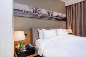 Noom Hotel Dakar Sea Plaza, a member of Radisson Individuals客房内的一张或多张床位