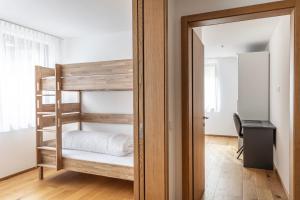 Postel nebo postele na pokoji v ubytování Berg Aparts Faschina - 05