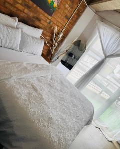 Ένα ή περισσότερα κρεβάτια σε δωμάτιο στο Heartbeat of Maboneng