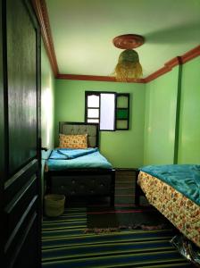 Postel nebo postele na pokoji v ubytování Gîte Assonfo Tachdirt + 20 fotografií