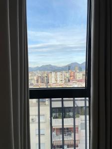 ein Blick auf eine Stadt aus einem Fenster in der Unterkunft Tirana Hideaways , Breathtaking View & Free Parking in Tirana