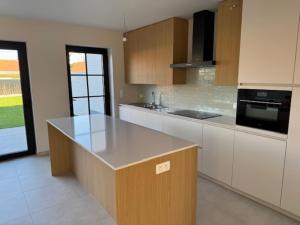 a kitchen with a island in the middle of it at Sœur in Berlare