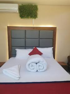 Katil atau katil-katil dalam bilik di Pathivara Hotel