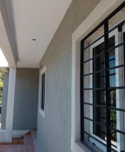 a room with a window in a house at Lihuel 1 AG in Alta Gracia