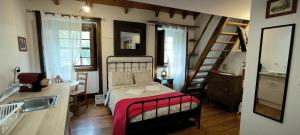 a small bedroom with a bed and a sink at Casas da Biquinha in Sintra