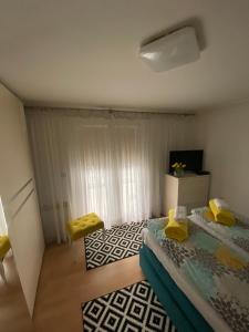 Ένα ή περισσότερα κρεβάτια σε δωμάτιο στο Bestay Sara