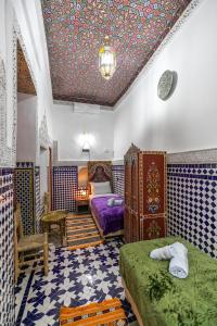 Postel nebo postele na pokoji v ubytování Dar Amazigh