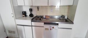 Kuchyň nebo kuchyňský kout v ubytování Too Spot