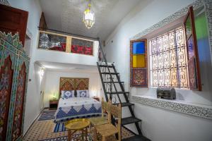 Postel nebo postele na pokoji v ubytování Dar Amazigh