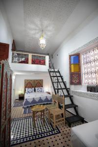 Postel nebo postele na pokoji v ubytování Dar Amazigh