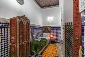 Postel nebo postele na pokoji v ubytování Dar Amazigh