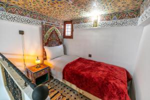 Postel nebo postele na pokoji v ubytování Dar Amazigh