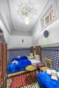 Postel nebo postele na pokoji v ubytování Dar Amazigh