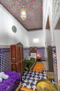 Postel nebo postele na pokoji v ubytování Dar Amazigh