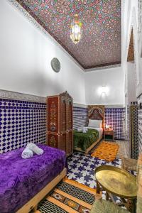 Postel nebo postele na pokoji v ubytování Dar Amazigh