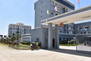 a person sitting on a bench in front of a building at Cozy homes sabaki in Nairobi