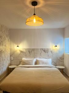 Ένα ή περισσότερα κρεβάτια σε δωμάτιο στο Villa el Paraiso