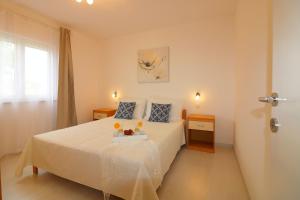 a bedroom with a bed with a tray of fruit on it at Melisa 5 in Poreč