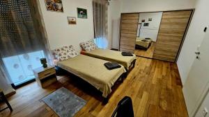 a living room with a couch and a table at festina lente in Osijek