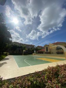 an empty basketball court with the sun in the sky at Sanremo Oasis, City di Mare, SRP in Cebu City