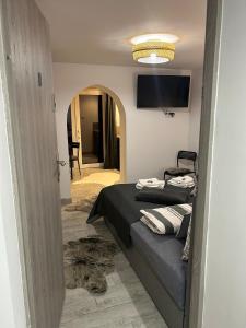 Ένα ή περισσότερα κρεβάτια σε δωμάτιο στο Apartamenty ARIA