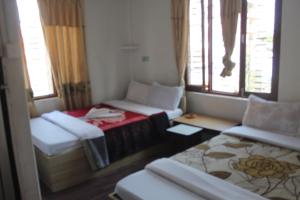 Ένα ή περισσότερα κρεβάτια σε δωμάτιο στο Hotel Air Pokhara