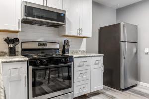 a kitchen with a stove and a refrigerator at 604 1 Two Bedroom One Bath with King near Main Street in St. Charles