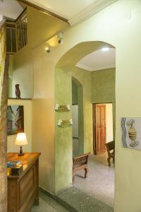 a room with a table and a bench in a room at Zanzibar Town Nest Hotel in Zanzibar City