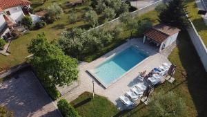an aerial view of a house with a swimming pool at Bungalow Melisa 8 in Poreč