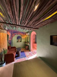 a living room with a couch and a ceiling at Casa Amina in Chefchaouene