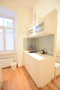 Kuchyňa alebo kuchynka v ubytovaní Elegant Apartment Foksal