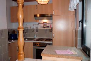 a kitchen with a stove and a counter top at Ferienhaus in Waren Müritz in Warenshof