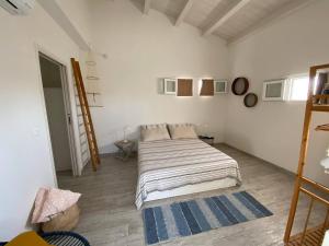 Ένα ή περισσότερα κρεβάτια σε δωμάτιο στο Tenuta Fico d'India - Casa Aliva