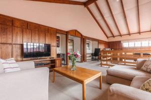 a living room with a couch and a table at Sandown Estate Apartment in Johannesburg