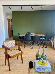 a dining room with a table and chairs in a room at Apartment in Montmartre in Paris +6 photos