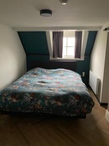 Postel nebo postele na pokoji v ubytování B&B Catharinenburg Golf & Wellness