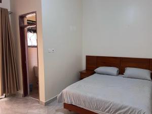 Postel nebo postele na pokoji v ubytování The Rêve Mbarara Hotel
