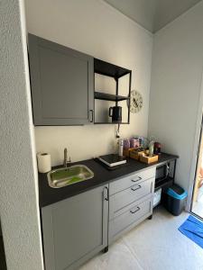 a kitchen with a sink and a counter top at Riccio 7'0 in Trapani