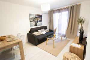 Posezení v ubytování Les Lodges de Saint Cassien 2