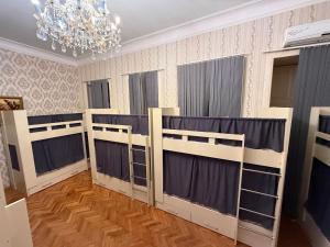 Postel nebo postele na pokoji v ubytování KM Hostel and Tourism