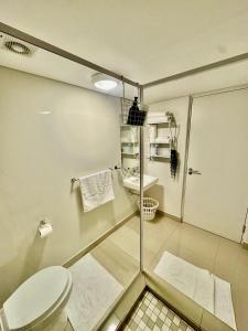 a bathroom with a toilet and a sink at 221 Millennial Umhlanga Ridge in Durban