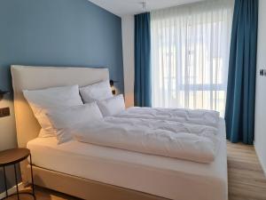 Postel nebo postele na pokoji v ubytování Eck am Meer 5
