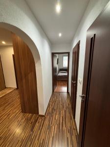 a hallway with an open door to a room at Apartman Gufo in Kysucké Nové Mesto