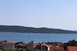a view of a large body of water with houses at Apartments A&G in Kaštela