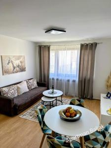 a living room with a couch and a table at Apartman Baljak in Livno