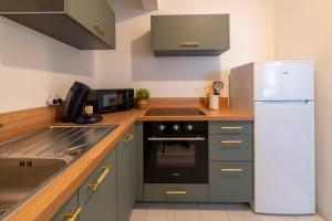 Kuchyň nebo kuchyňský kout v ubytování Appartement 2 à 4 personnes Calais