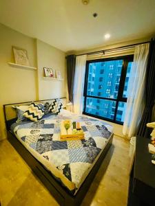 En eller flere senge i et værelse på The base Central 741 by Numam + 66 billeder