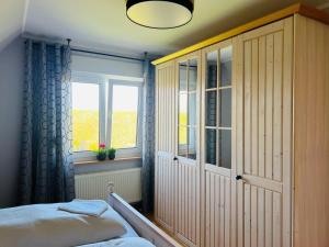 En eller flere senge i et værelse på Ferienhaus Liese - Haupthaus