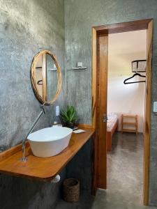 a bathroom with a sink and a mirror at Aquarela Lofts em Icaraizinho in Amontada +9 photos